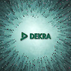 A huge DEKRA logo lies on the ground. People are streaming towards the logo from all directions.